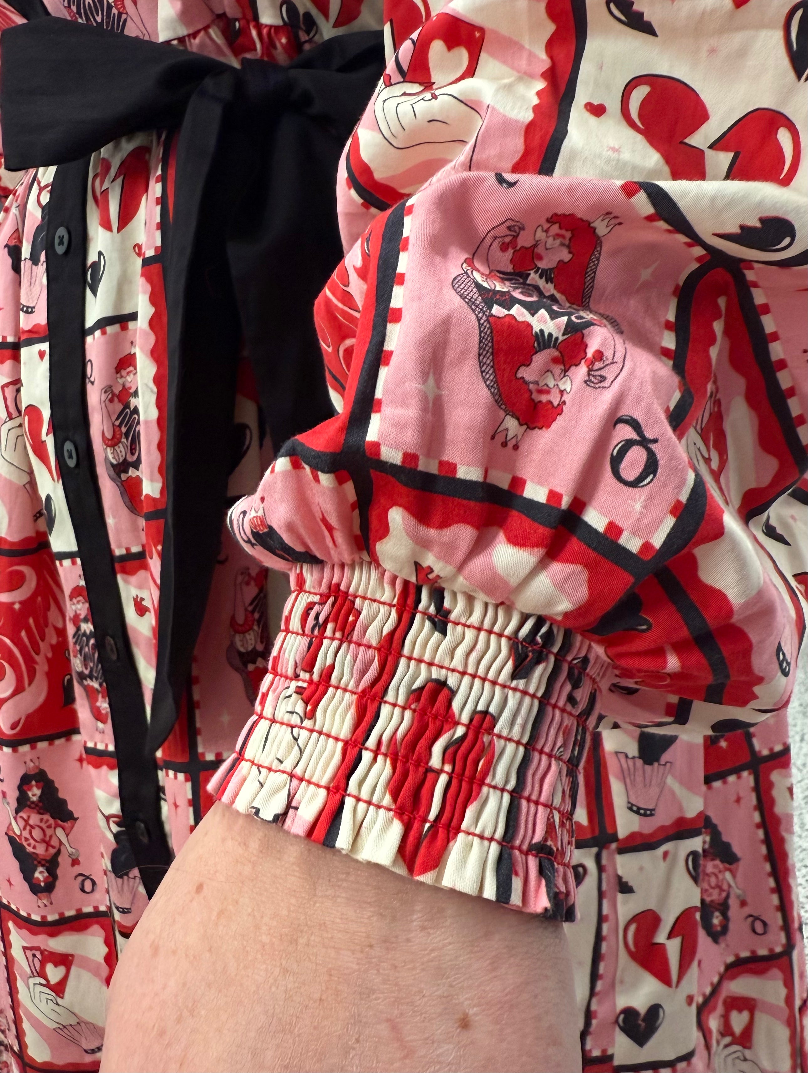 Model wearing Toomi Queen of Hearts cotton maxi babydoll dress in hand-illustrated heart print